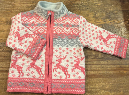 pink and white jacket, with jumping reindeers